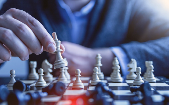 A person moving chess board coin